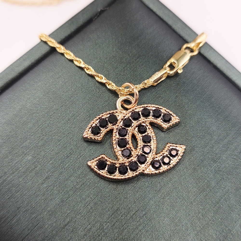 CHANEL Black and Gold Logo Necklace